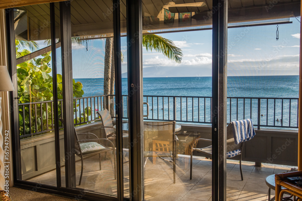 Wall mural a room with a tropical view 2