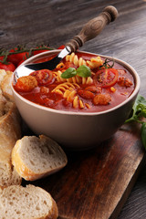 Tomato soup with meatballs in a bowl. Italian minestrone soup