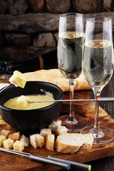 Gourmet Swiss fondue dinner on a winter evening with assorted ch