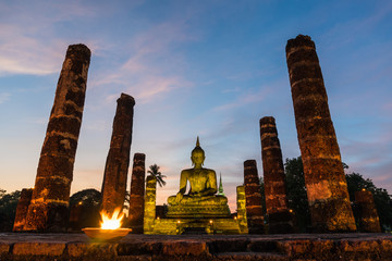 Buddha statue wat mahathat temple in the night at sukhothai thailand