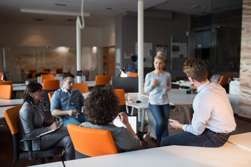 Obraz premium Young Business Team At A Meeting at modern office building