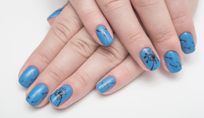 Female hands with blue nails art, manicure