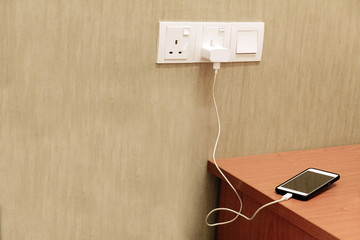 Electric socket with connected phone charge