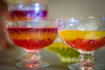 Large glasses with cocktails and jelly