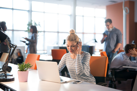 businesswoman using a laptop in startup office