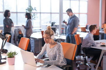 businesswoman using a laptop in startup office