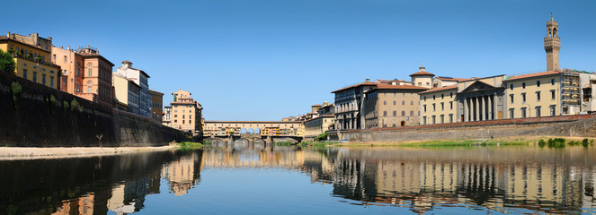 Panorama view of famous Old Bridge (Ponte Vecchio) as seen from under the Bridge (Ponte alle Grazie). Florence, Italy.