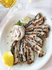 beer and sardines on table