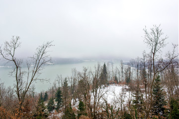 view to Lake Plastira panorama in a foggy morning with snowy mountain and reflection.Thessaly, Greece