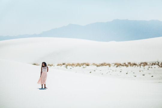 Young Woman standing in desert