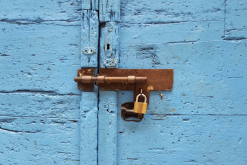 lock on a blue wooden door