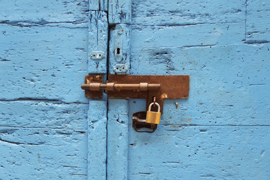 lock on a blue wooden door