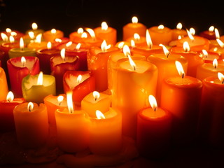 Close up of red burning candles.