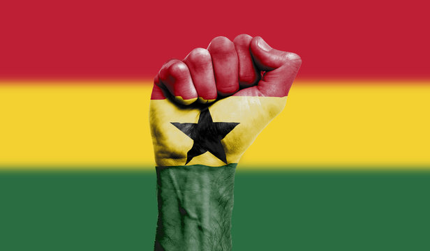 Ghana flag painted on a clenched fist. Strength, Power, Protest concept