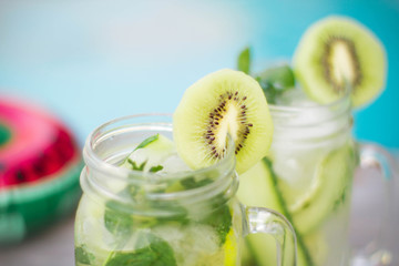 Detox with Cucumber, kiwi and lime around the pool