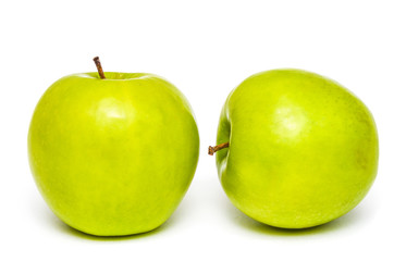 Two fresh green apples on isolated white background