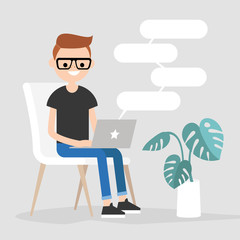 Young nerdy character typing messages on a laptop. Remote communication. Modern lifestyle. Copy space. Flat editable vector illustration.