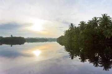 Foto op Canvas Glassy surface  Lake Marawila, Sri Lanka © tagstiles.com