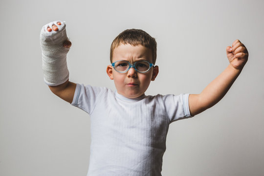 Kid Posign Tough with Arm Cast