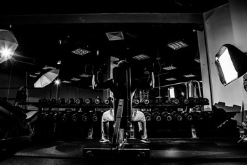 Strong man working in gym