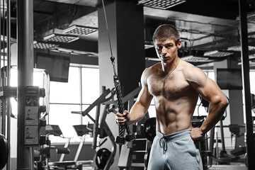 Fototapeta na wymiar Strong man working in gym