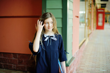 Kid girl in school uniform