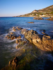 Waves bathing a rock