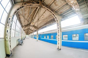 Vintage retro platform passenger railway station. Concept of meeting, waiting, seeing people on the road trip