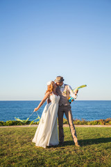 Bride and groom on a romantic moment on nature. Stylish wedding couple outdoors