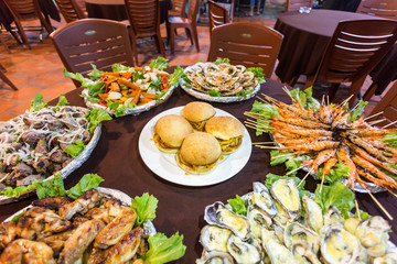 burgers and other dishes in one table