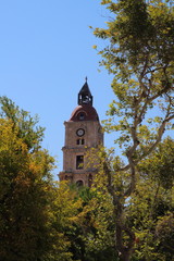 Fototapeta na wymiar Medieval clock tower in Rhodes, Greece