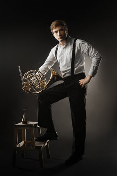 French horn player. Classical musician portrait