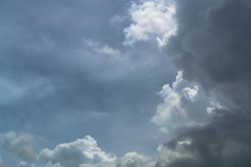 Before the rain fell, the clouds gathered together in the darkness of the sky.