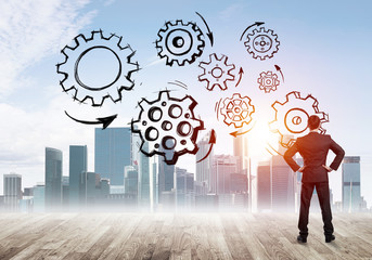 Cogwheel engine drawn on screen as symbol for teamwork and cooperation