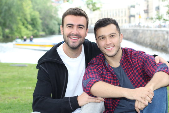 Happy couple smiling during date in the park