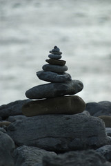 Fototapeta premium Zen stones in perfect balance with sea background