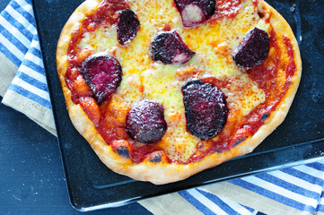 delicious homemade pizza on a platter - 167975301