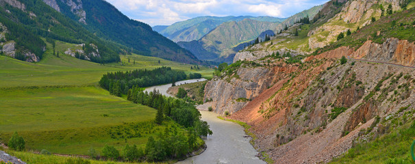 Muddy mountain river from melting snow flowing from the glacier peaks. Chuya River, Chuisky tract, Gorny Altai, Siberia, Russia.