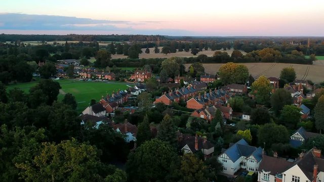 Elevated capture of Hartley Wintney village houses and cricket green in Hartley Wintney, UK.