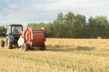 Special machines for harvesting form round bales of hay.