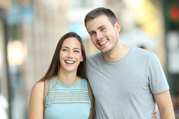 Fototapeta premium Happy couple walking together on the street