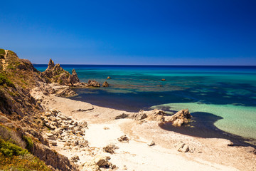 Spiaggia di Rena Maiori beach with azure clear water and mountains,Sardinia, Italy