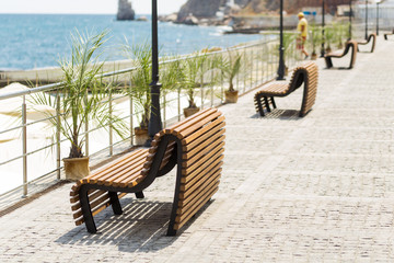 Wooden bench on embarkment