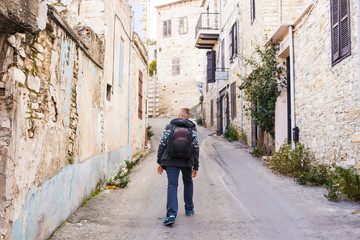Fototapeta premium Man traveler with hat and backpack enjoying view