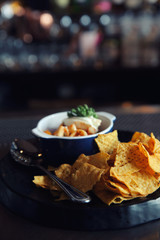 Nachos on dark tone , Mexican food