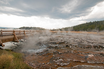 Boardwalk over Hot Cascades hot spring in the Lower Geyser Basin in Yellowstone National Park in Wyoming United States