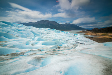 A large slope of a blue glacier. Shevelev.