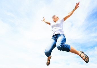 Woman In Her 50s Jumping High