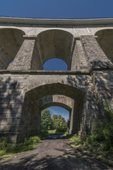 Fototapeta premium Stone rail viaduct near Sychrov village