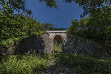 Fototapeta na wymiar Stone rail viaduct near Sychrov village